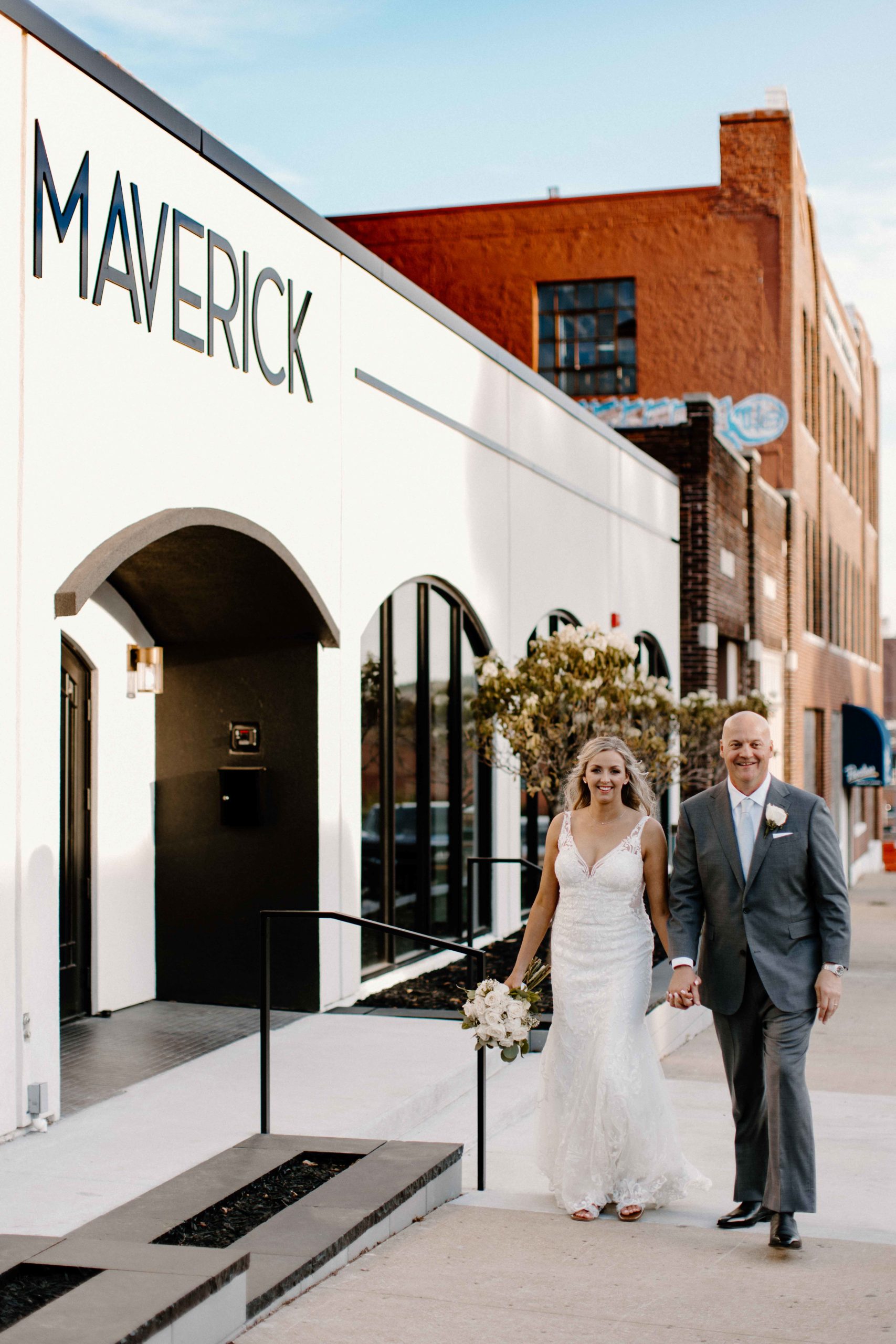 Wedding couple in front of The Maverick in downtown Kansas City